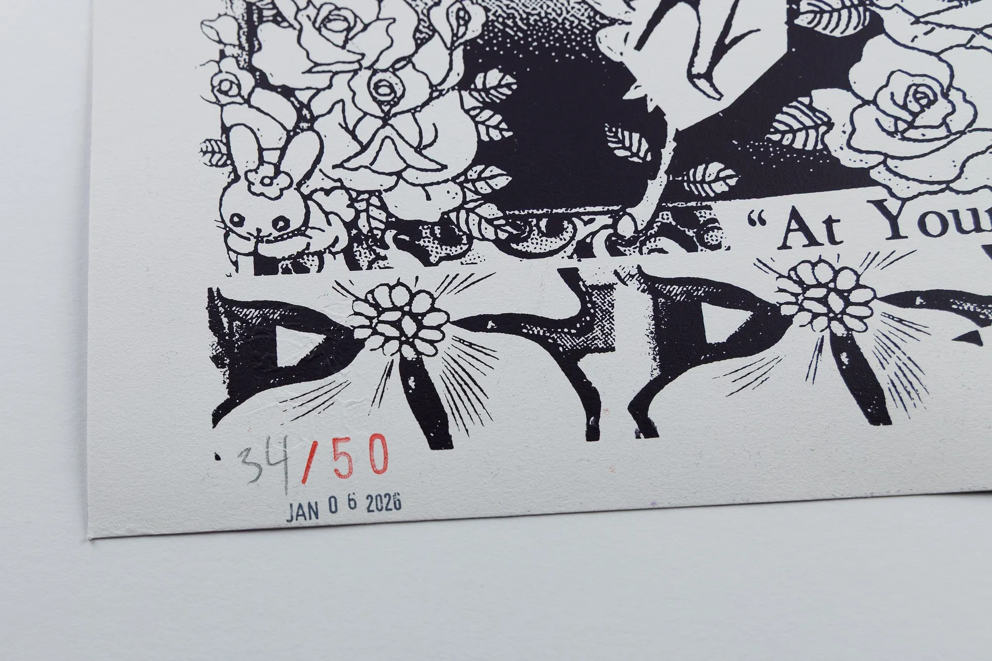 Close-up of the lower-left corner of the print's back: 34 written in pencil before a red-stamped /50, with JAN 06 2026 stamped beneath it.