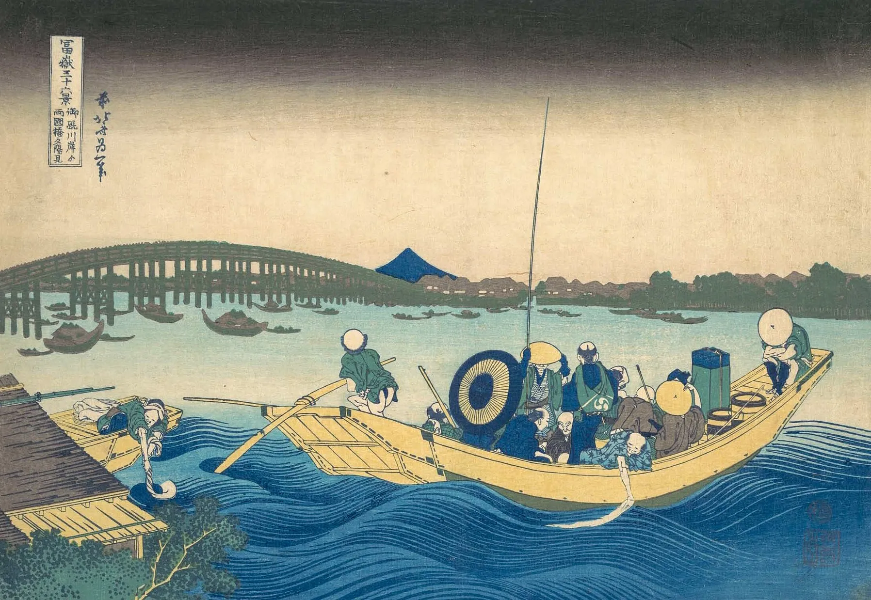 A reproduction of a Japanese woodblock print — boatmen poling on a river at dusk, with a long bridge and Mount Fuji beyond.